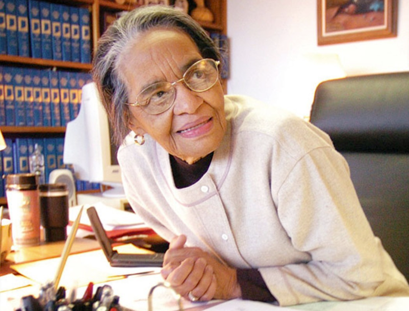 Viola J. Taliaferro sits at her desk.