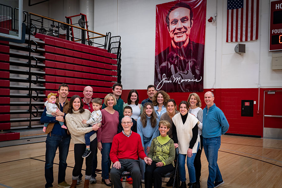 Coach Jim Morris stands with his family in the IU Southeast gym.