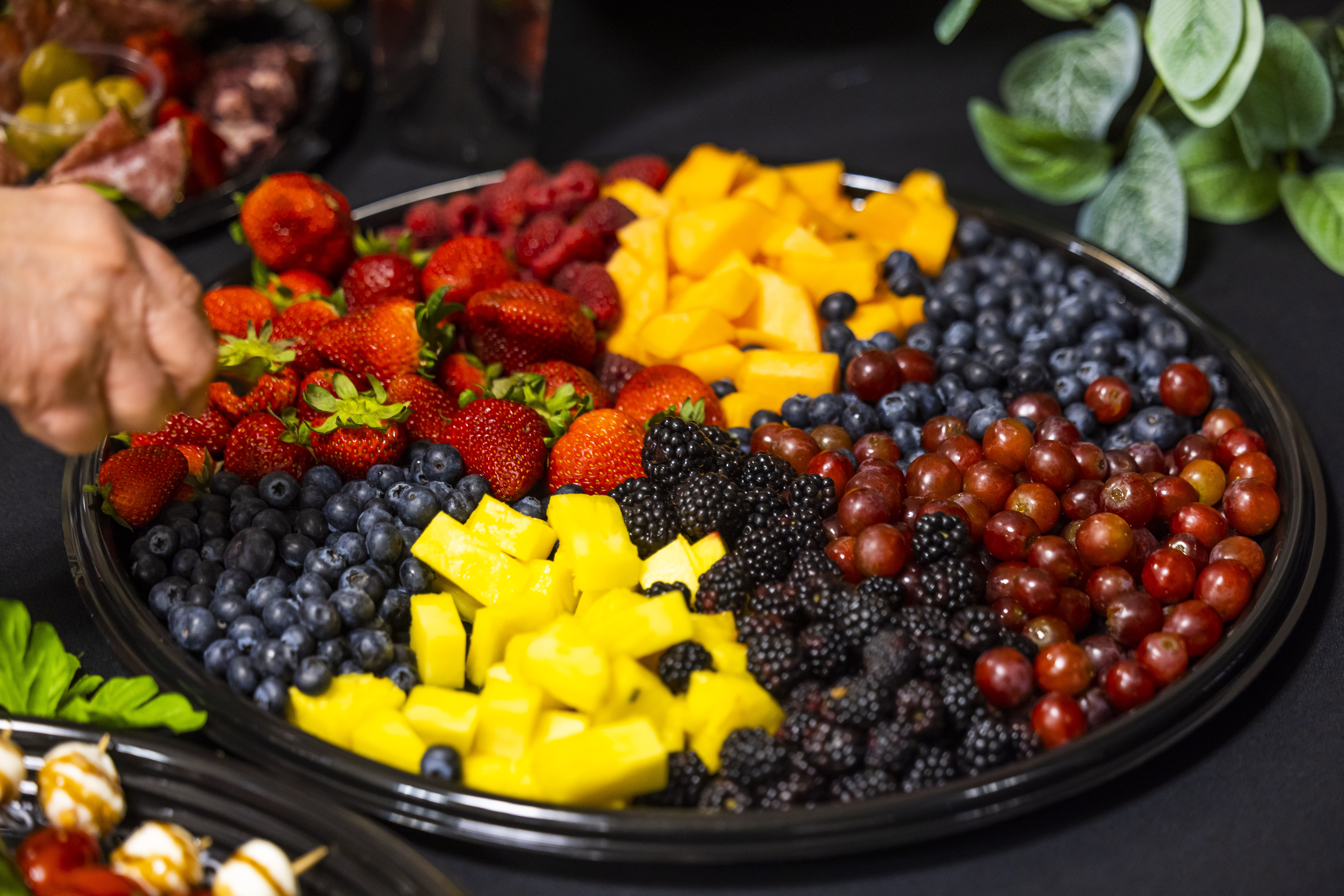 A plate of assorted fresh fruit.