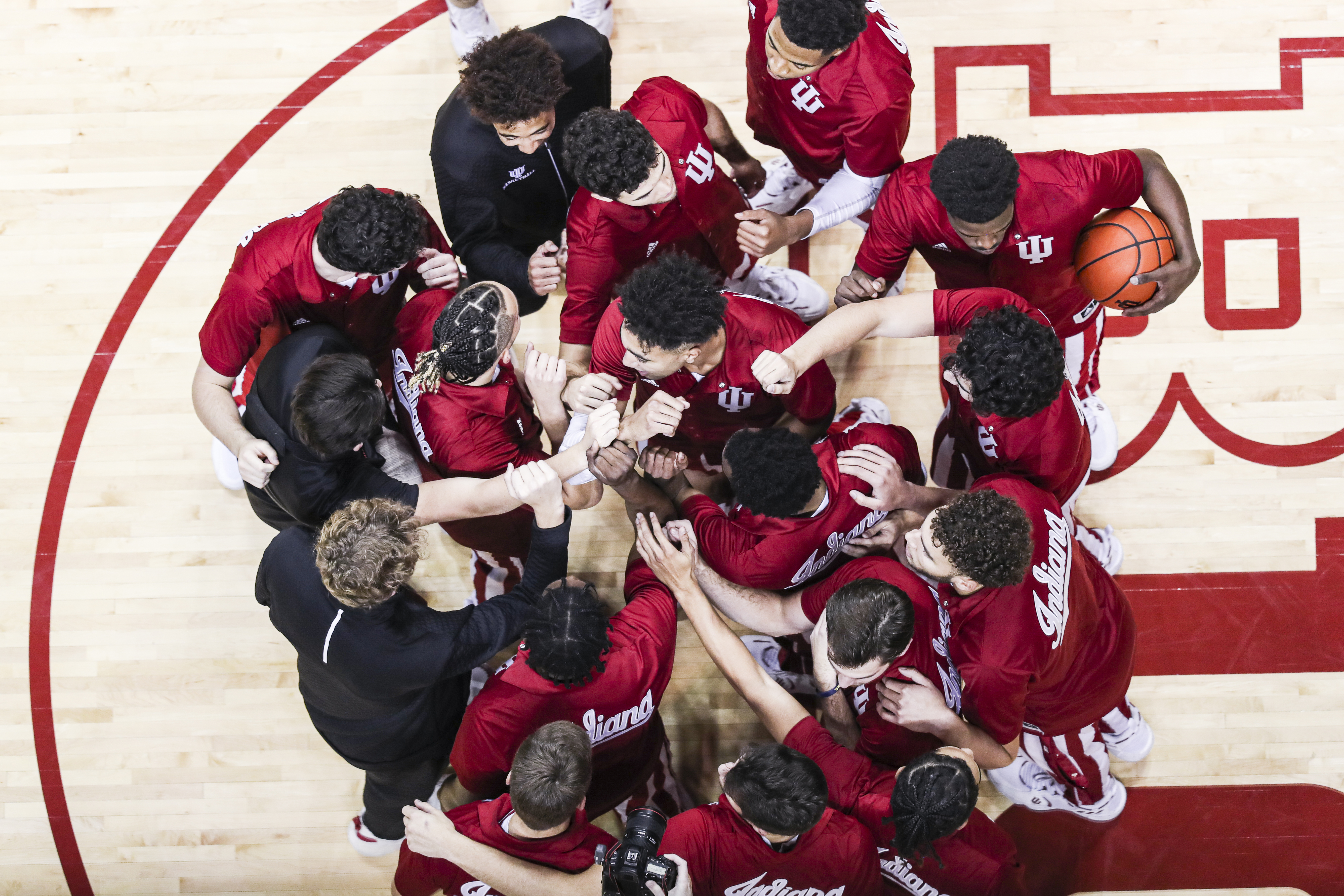 Aerial view of IU basketball team huddle