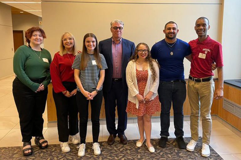 Recipients of the Emerging Leaders Honors Scholarship stand with former IUSB chancellor Terry Allison.