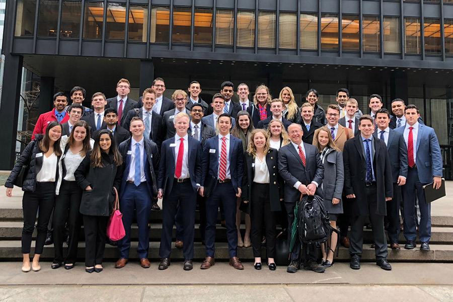 A large group of business students posing together.