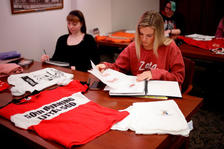 Students look over the history of Little 500 apparel.