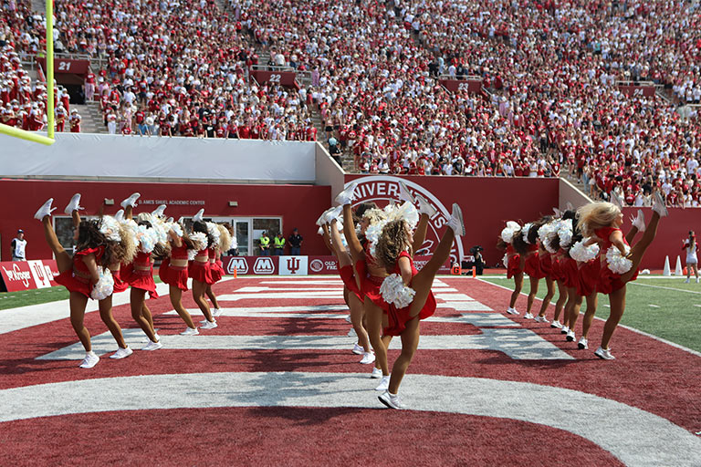 The Red Steppers perform at an IU football game.
