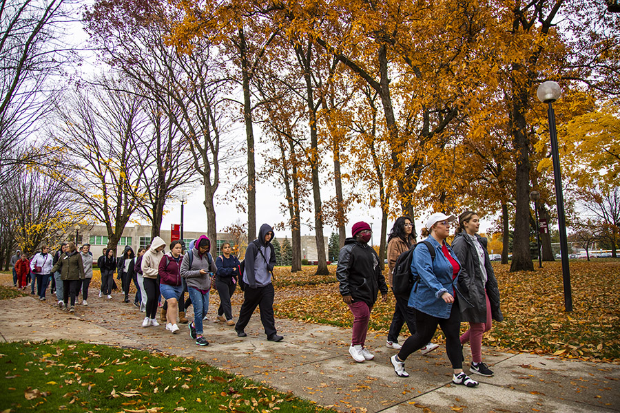 A group of students walking outside.