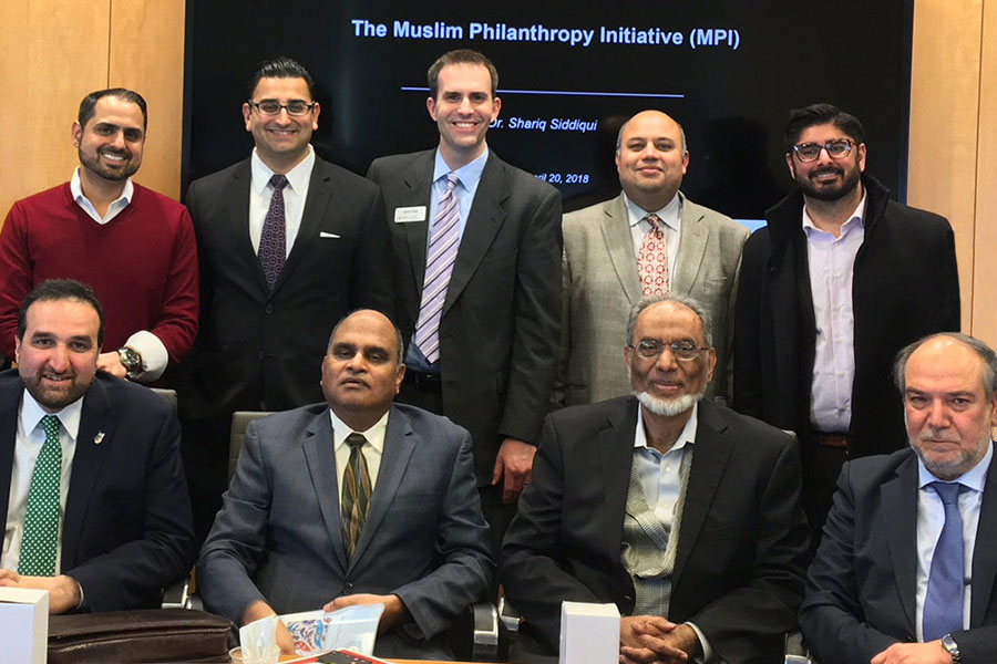 Several men from the Muslim Philanthropy Initiative poses for a group shot.