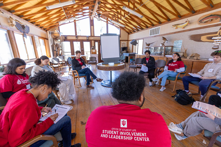 Students sit in a circle in a classroom at Bradford Woods.