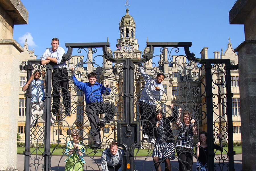 A group hands on a gate at the Royal Naval College in Greenwich.