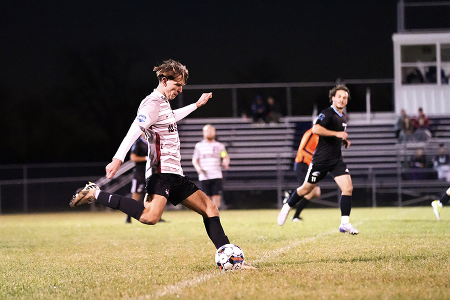 The men's soccer team playing a match.